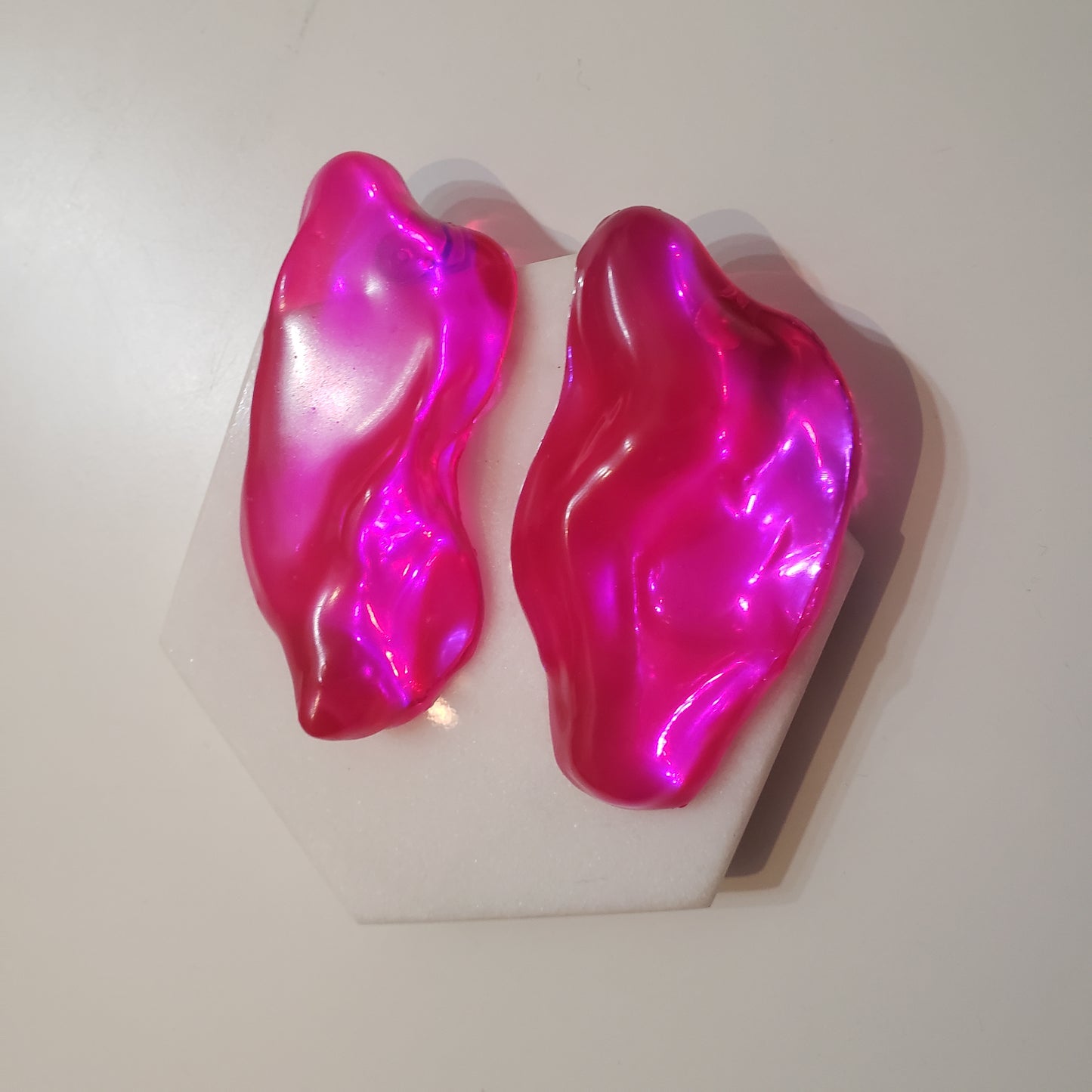 Asymmetrical Resin Earrings.  Lightweight.  Surgical Steel Post Backing. Dimensions: 1 ½ inch W x  2 ½ inches H.  Designed and handmade in Brooklyn, NY.